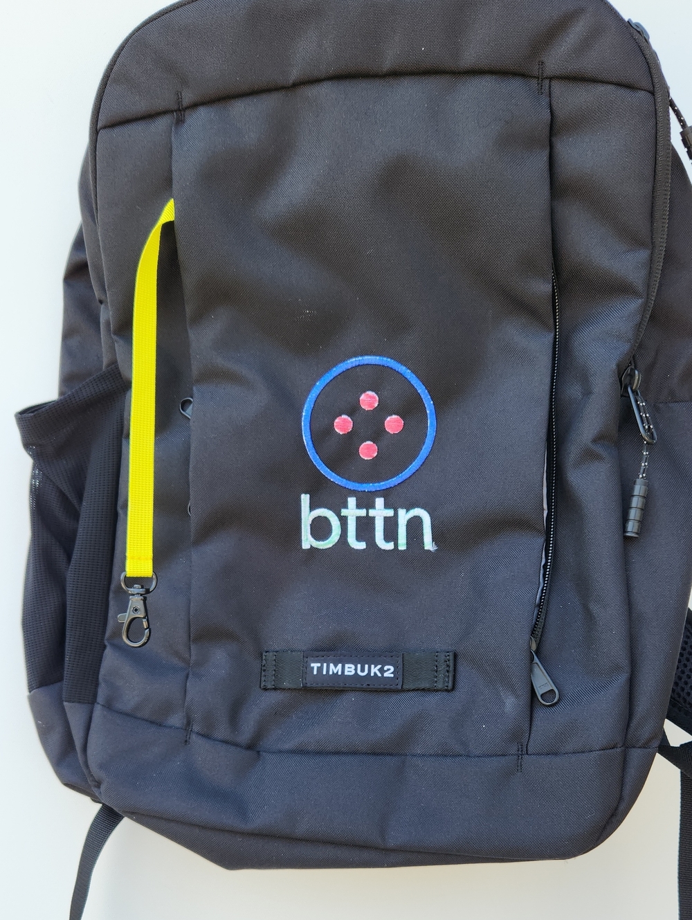 Timbuk2 Black Backpack with Yellow Accent and Blue Logo